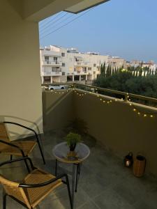 a patio with a table and chairs on a balcony at Melissa 2 Block A in Paralimni