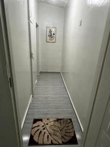 a hallway with a rug on the floor of a room at Aviela Residences in Solwezi