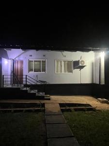 a house with a speaker on the side of it at night at Aviela Residences in Solwezi