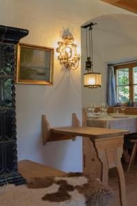 a bathroom with a table and a sink and a mirror at Landhaus No 12 mit privater Sauna in Bayrischzell