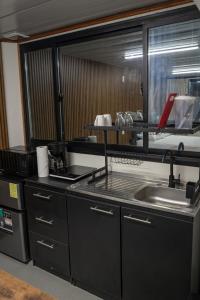 a kitchen with a sink and a counter at Cocles Green Studios in Cocles +20 photos