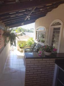 a porch with a couch on a patio at Casa do Bosque in Sao Jose do Rio Preto