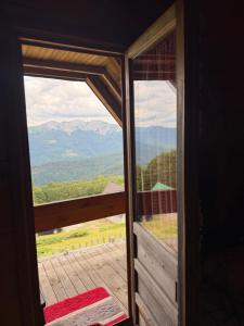 a view of a mountain from the door of a room at Planinska Koliba Mo in Katun Božički +7 photos