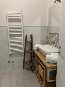 a bathroom with a sink and a mirror and a tub at Sagittabondo in Campobasso +29 photos