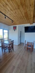 a dining room with a table and chairs at Vila Nakaj Guest House in Gjirokastër