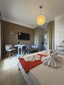 a bedroom with a bed with a swan on it at Apartments Antonio in Pag