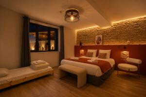 a bedroom with a large bed and a window at Gite De La Borie in Saint-Ignat +38 photos