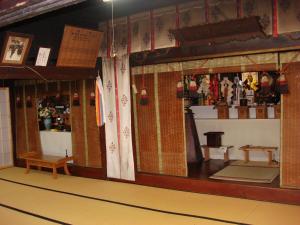 a room with a counter with a lot of items at Shukubo Kanbayashi Katsukane in Tsuruoka