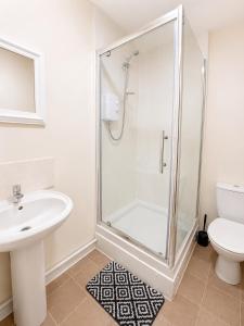 a bathroom with a shower and a sink and a toilet at 52 - room 2 - smart TV in Swansea