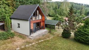 an aerial view of a small house in the woods at Chata Pod Dubem Kameňák in Moravany