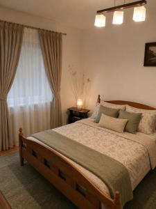 a bedroom with a large bed and a window at Noclegi na winnicy in Dys +37 photos