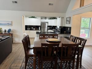 a kitchen and dining room with a wooden table and chairs at Charming Room in Martinez in Martinez