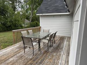 a patio with a table and chairs on a deck at Charming Room in Martinez in Martinez