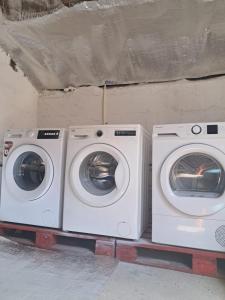 two washing machines sitting next to each other at Casa do Tempo Espinhoso in Vinhais
