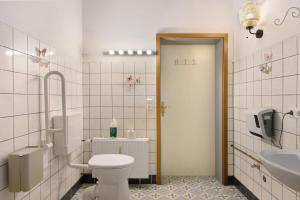 a bathroom with a toilet and a sink at Jurte Falken Nest in Eisenbach +32 photos