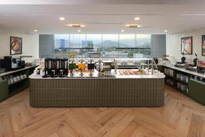 a store with a counter in the middle of a room at Hampton by Hilton Monterrey Tecnológico in Monterrey