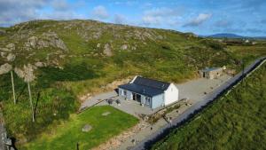 an aerial view of a house on a hill at Mary’s Seaview Clifden in Errislannan