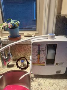 a microwave sitting on a counter next to a window at Vancouver lovely home in Vancouver