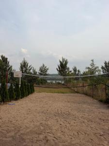 a volleyball court with a volleyball net on a beach at Umunota Escape in Bugesera +6 photos
