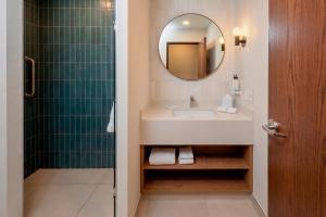 a bathroom with a sink and a mirror at Hampton by Hilton Monterrey Tecnológico in Monterrey +37 photos