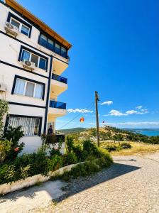 a building on the side of a beach at Ada Hill Ayvalık in Ayvalık
