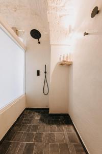 a room with a window and a tile floor at Nobile Dimora di Puglia in Ostuni