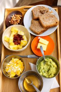 a wooden tray with different types of food on it at Bio Espacio in Belén de Escobar