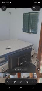 a computer monitor sitting on top of a table at Francolini dptos in La Banda