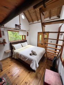 a bedroom with a large bed in a house at Hospedaje La Tierrita Villa de Leyva in Villa de Leyva +123 photos
