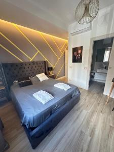 a bedroom with a large bed in a room at Dorian Gray Luxury Suite in Trieste