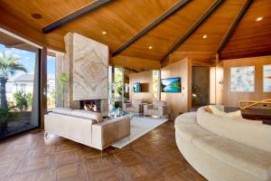 a living room with a couch and a fireplace at Via Vallarta in Los Angeles