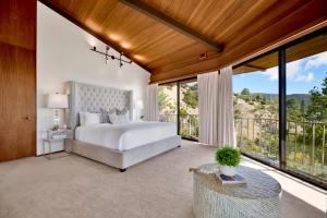 a bedroom with a bed and large windows at Via Vallarta in Los Angeles +92 photos