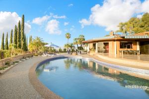 a swimming pool in front of a house at Via Vallarta in Los Angeles