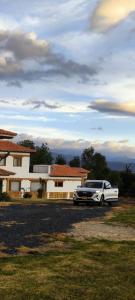 a limousine parked in front of a house at Casas Villa de Leyva in Villa de Leyva