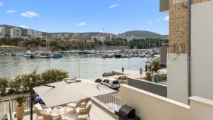 a balcony with a view of a marina at Villa Olea Mandalina in Šibenik