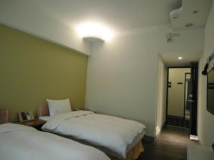 Postel nebo postele na pokoji v ubytování 237 Hotel