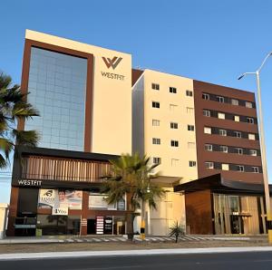 a building with a sign on the side of it at Studio Estilo Industrial - 01 - BARRETO - in Mossoró