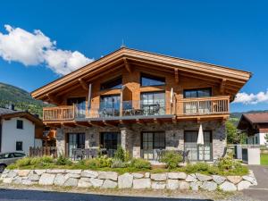 a log home with a wrap around deck at Tauernlodge Chalet Salzach in Niedernsill