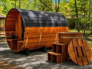 a wooden wine barrel and a wooden barrel at Golden Deer Lodge Hot Tub Sauna Sleeps 12 in Tobyhanna