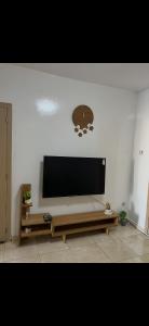 a living room with a large flat screen tv on a wall at Relax appartement in Nouakchott