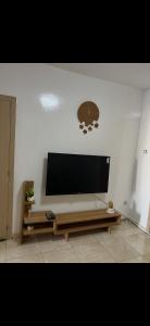 a living room with a large flat screen tv on a wall at Relax appartement in Nouakchott