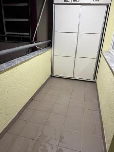 an empty room with a sliding glass door at Dardi in Peje +2 photos