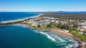 an aerial view of the shoreline of a beach at Sunnyvale 2 - Lifestyle Yamba in Yamba