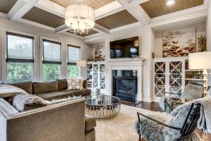 a living room with a couch and a fireplace at Executive 5BR Stay in Duluth w/ Pool Access in Duluth
