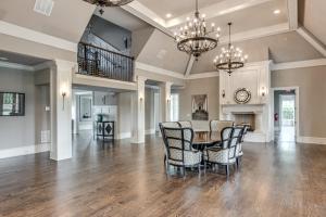 a dining room and living room with a table and chairs at Executive 5BR Stay in Duluth w/ Pool Access in Duluth
