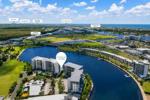 an aerial view of the city and the water at Waterline at Oceanside in Kawana Waters