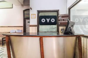 a bar with an ovo sign on top of it at Hotel O Prem Chunaria in Morādābād