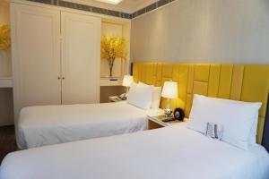 Uma cama ou camas num quarto em Hotel Madera Hollywood