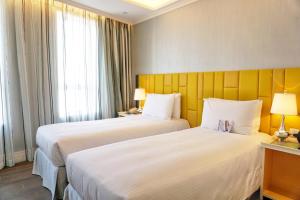 Uma cama ou camas num quarto em Hotel Madera Hollywood