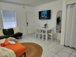 a living room with a couch and a table at Cozy studio in Hollywood 101 - 1 in Hollywood